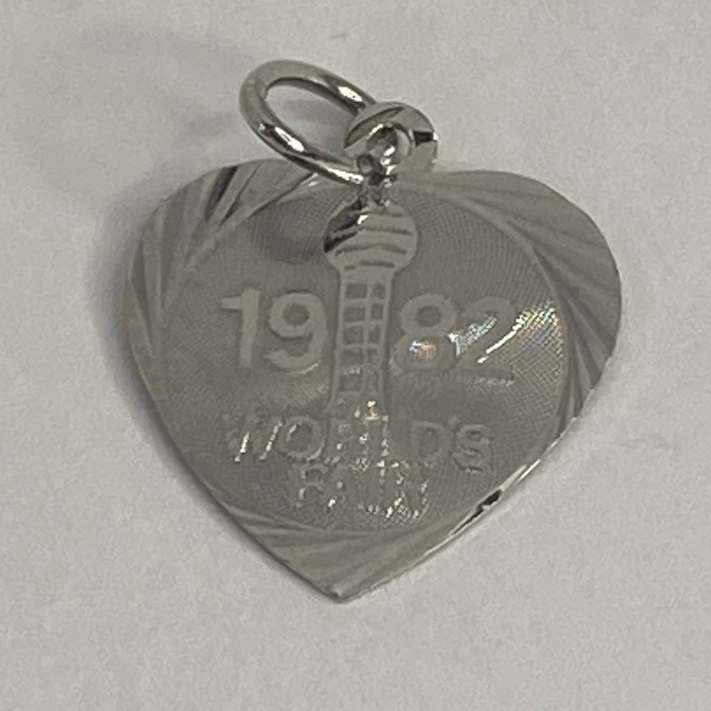 1982 WOLDS FAIR CHARM IN STERLING SILVER